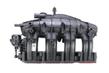 Black OEM intake manifold for a vehicle, featuring various connectors and a throttle body.