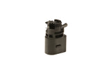 Black plastic automotive sensor component for German car engine maintenance.