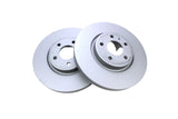 Two new silver metallic brake rotors for European cars on a white background