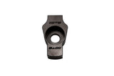 Black metal automotive component with central circular opening and engraved markings.