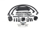 Black aftermarket oil cooler kit with hoses, brackets, and mounting hardware