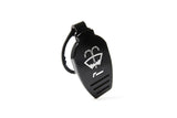 Black automotive fluid cap with white symbol and grip ridges