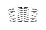 Set of four silver automotive coil springs for vehicle suspension
